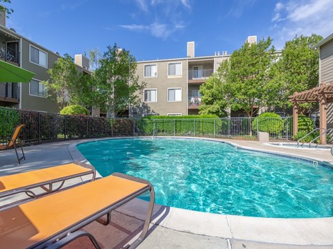 our apartments have a large pool and a patio with picnic tables